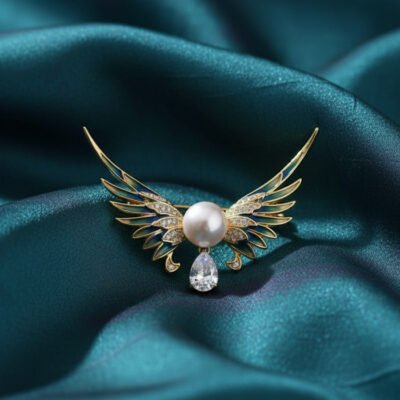 Angel Wing Brooch with Enamel, Pearl, and Teardrop Stone