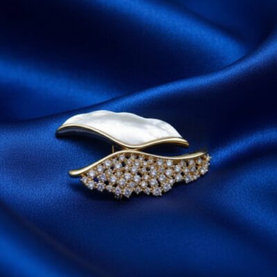 Elegant Mother-of-Pearl and Crystal Wave Brooch